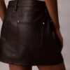 Μίνι φούστα από συνθετικό δέρμα με 5 τσέπες Μίνι φούστα από συνθετικό δέρμα με 5 τσέπες