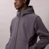 Μπουφάν Softshell με κουκούλα και φερμουάρ Μπουφάν Softshell με κουκούλα και φερμουάρ