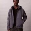 Μπουφάν Softshell με κουκούλα και φερμουάρ Μπουφάν Softshell με κουκούλα και φερμουάρ