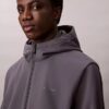 Μπουφάν Softshell με κουκούλα και φερμουάρ Μπουφάν Softshell με κουκούλα και φερμουάρ