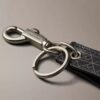 Μπρελόκ με λογότυπο σε όλη την επιφάνεια Μπρελόκ με λογότυπο σε όλη την επιφάνεια